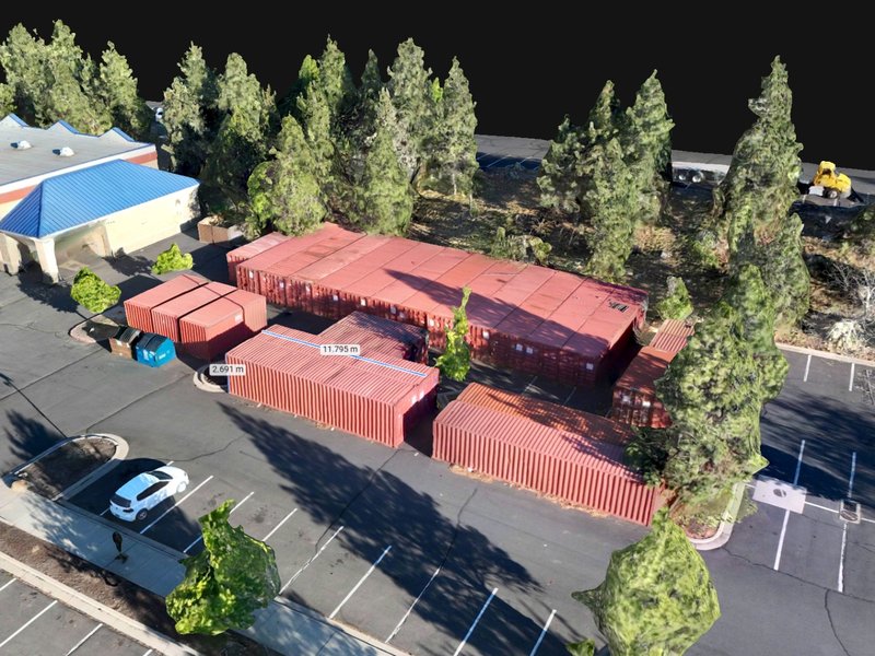 3D photogrammetric model with measurement overlays of a commercial site